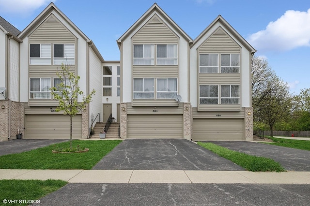 684 Diamond Pointe Dr, Mundelein, IL 60060 - multi unit property featuring driveway, an attached garage, and brick siding