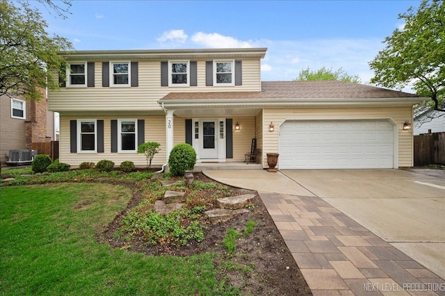 20 S Cambridge Dr, Geneva, IL 60134 - view of front of home with a garage, driveway, central air condition unit, and a porch