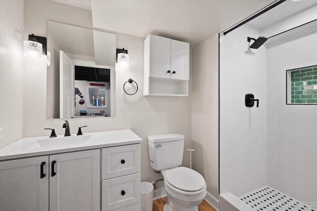 20 S Cambridge Dr, Geneva, IL 60134 - bathroom featuring toilet, a tile shower, and vanity