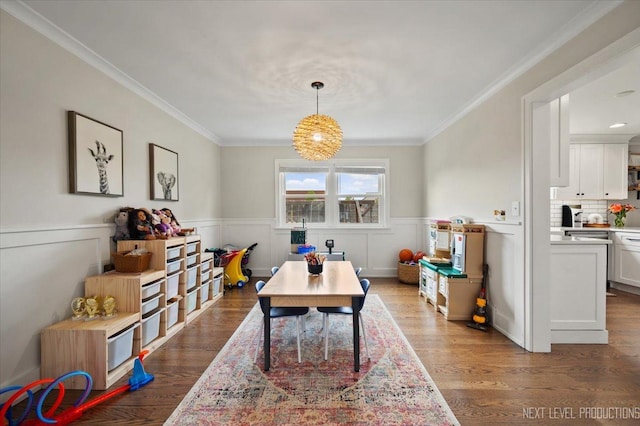 20 S Cambridge Dr, Geneva, IL 60134 - recreation room with ornamental molding, wood finished floors, and wainscoting