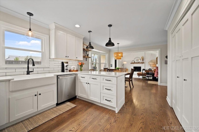 20 S Cambridge Dr, Geneva, IL 60134 - kitchen with dishwasher, a peninsula, light countertops, crown molding, and white cabinetry