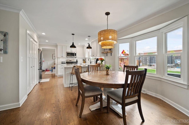 20 S Cambridge Dr, Geneva, IL 60134 - dining area featuring crown molding, plenty of natural light, baseboards, wood finished floors, and recessed lighting