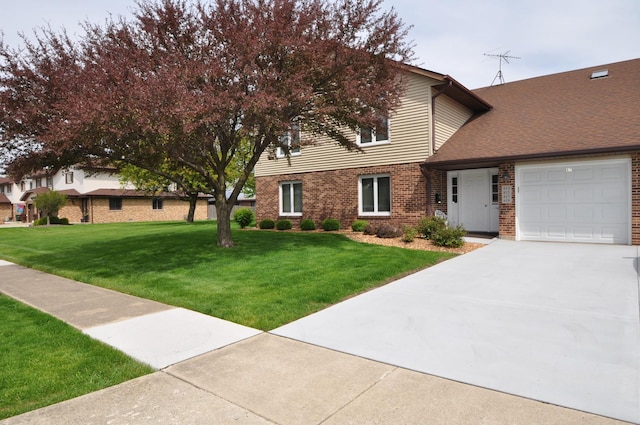 815 Meadow Rdg Unit 2, New Lenox, IL 60451 - view of front of house featuring a front yard, driveway, a garage, and brick siding