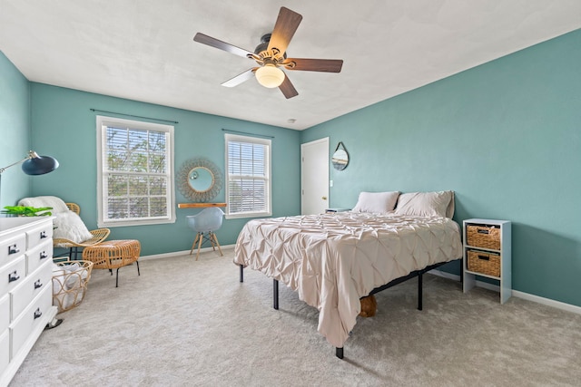 bedroom featuring carpet floors, baseboards, and ceiling fan