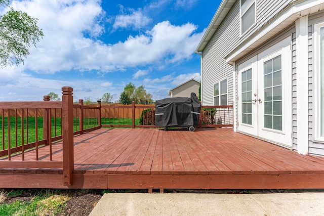 wooden deck featuring french doors and fence