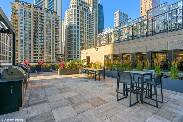 30 E Huron St Unit 1110, Chicago, IL 60611 - view of patio with a view of city, outdoor dining space, and grilling area