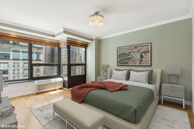 30 E Huron St Unit 1110, Chicago, IL 60611 - bedroom with ornamental molding, wood finished floors, a chandelier, and baseboards
