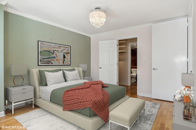 30 E Huron St Unit 1110, Chicago, IL 60611 - bedroom with a chandelier, crown molding, light wood finished floors, and baseboards