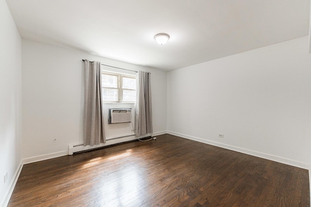 empty room with a baseboard heating unit, dark wood-style flooring, a wall mounted air conditioner, and baseboards