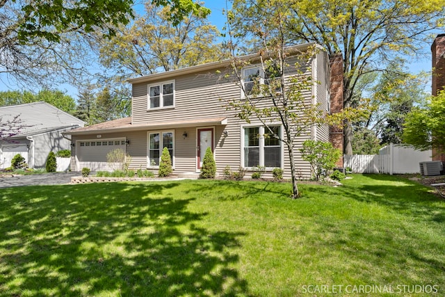 traditional-style house featuring central AC, a garage, a chimney, and driveway
