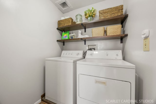 laundry room with washing machine and clothes dryer