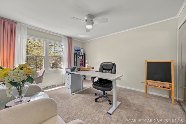 office area with crown molding, ceiling fan, light carpet, and baseboards