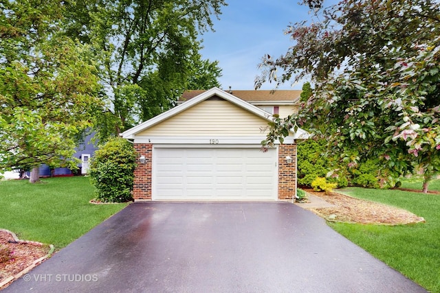 190 Washo Ct, Lake Zurich, IL 60047 - view of front of house with brick siding, asphalt driveway, a front yard, and a garage