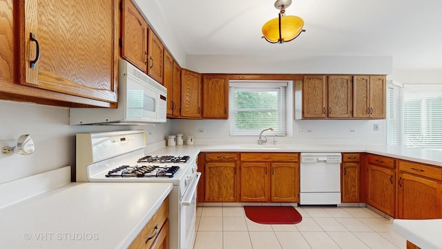 190 Washo Ct, Lake Zurich, IL 60047 - kitchen with white appliances, a sink, brown cabinets, and light countertops