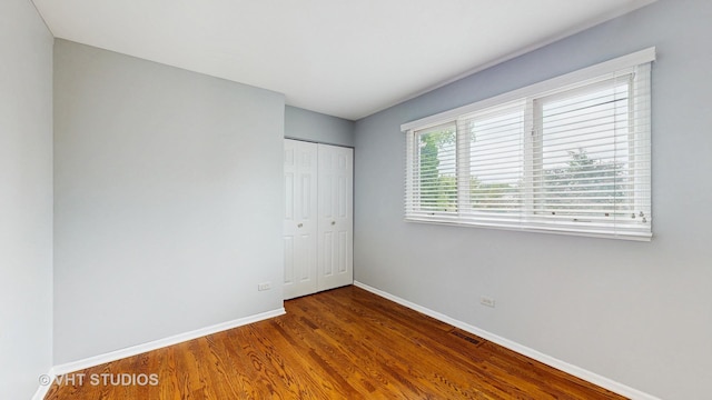 190 Washo Ct, Lake Zurich, IL 60047 - unfurnished bedroom featuring baseboards, a closet, and wood finished floors