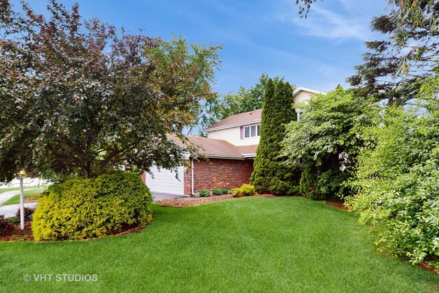 190 Washo Ct, Lake Zurich, IL 60047 - view of green lawn with a garage