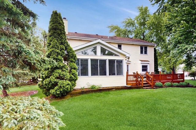 190 Washo Ct, Lake Zurich, IL 60047 - rear view of property featuring a wooden deck, a yard, a sunroom, and a chimney