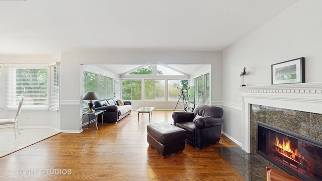 190 Washo Ct, Lake Zurich, IL 60047 - living room featuring a high end fireplace, plenty of natural light, wood finished floors, vaulted ceiling, and baseboards