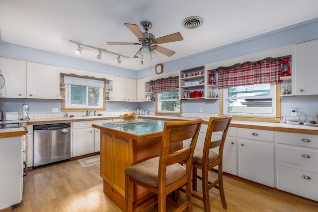 2651 E 2900 N Rd, Ancona, IL 61311 - kitchen featuring stainless steel dishwasher, open shelves, light wood-style floors, and white cabinets