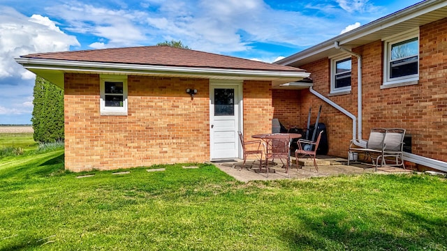 2651 E 2900 N Rd, Ancona, IL 61311 - back of house with a patio, a lawn, and brick siding