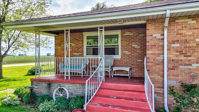 2651 E 2900 N Rd, Ancona, IL 61311 - doorway to property with a porch and brick siding