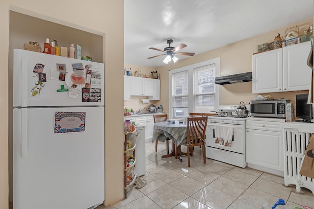 kitchen featuring white appliances, under cabinet range hood, white cabinets, and ceiling fan