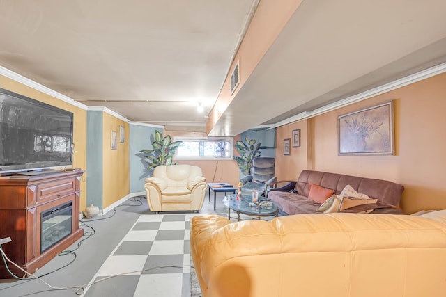 living room featuring crown molding, tile patterned floors, and baseboards