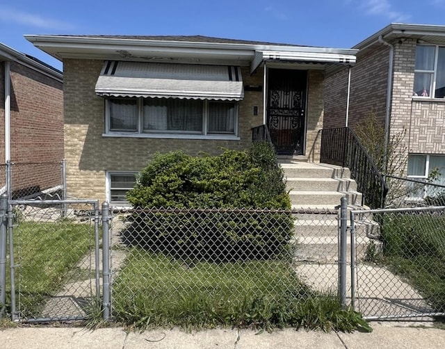 7502 W 64th St, Summit, IL 60501 - view of front facade featuring a gate, brick siding, and fence