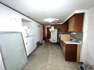 7502 W 64th St, Summit, IL 60501 - kitchen with freestanding refrigerator and light countertops