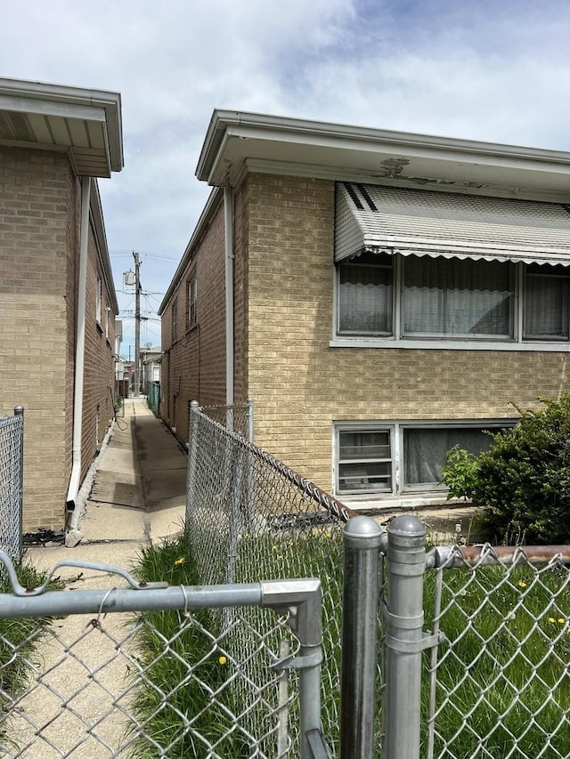 7502 W 64th St, Summit, IL 60501 - view of home's exterior with brick siding and fence