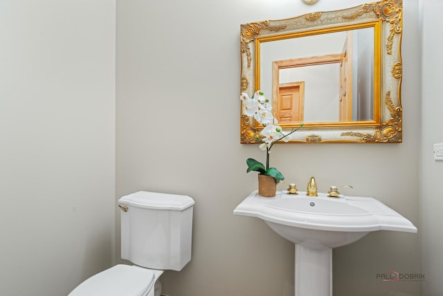half bath featuring toilet
