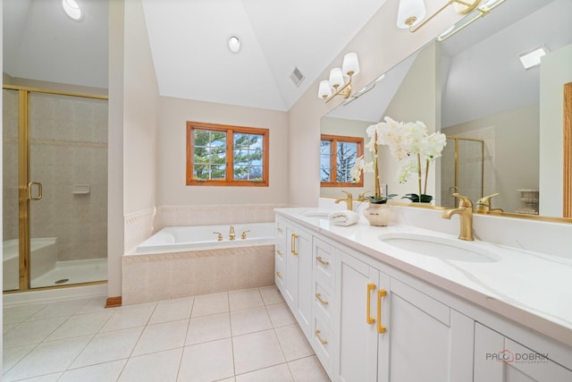 full bathroom featuring vaulted ceiling, a shower stall, a bath, tile patterned floors, and double vanity