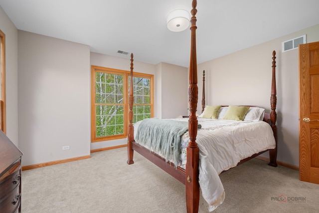 carpeted bedroom with baseboards