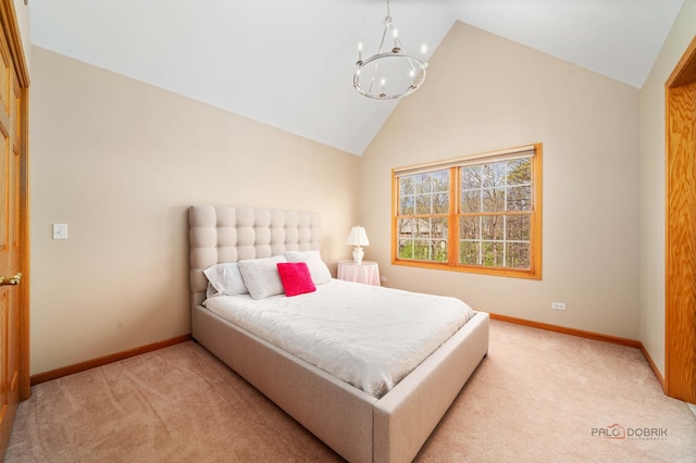 bedroom with light carpet, baseboards, a chandelier, and high vaulted ceiling