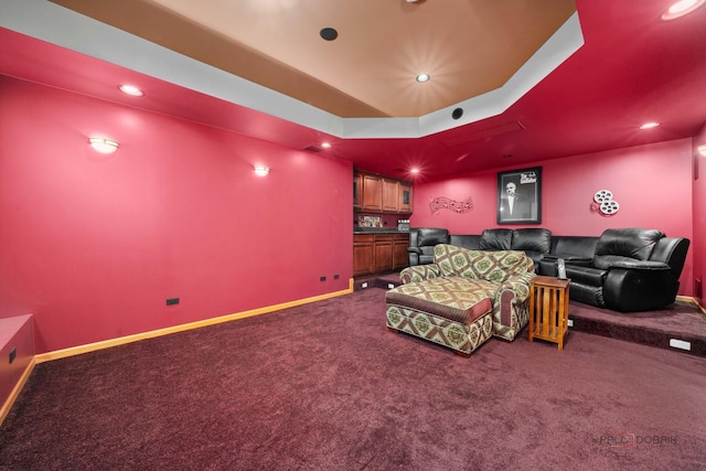 home theater room with dark carpet, recessed lighting, and baseboards