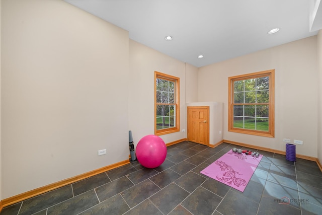workout room with baseboards and recessed lighting