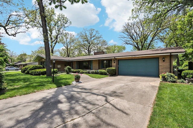 ranch-style home with brick siding, a garage, driveway, and a chimney