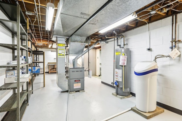 unfinished basement with gas water heater, heating unit, and concrete block wall