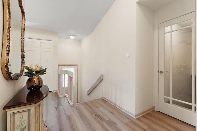 entrance foyer with light wood-type flooring and baseboards