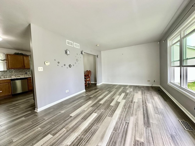 815 S Oak St, West Chicago, IL 60185 - unfurnished living room featuring wood finished floors and baseboards