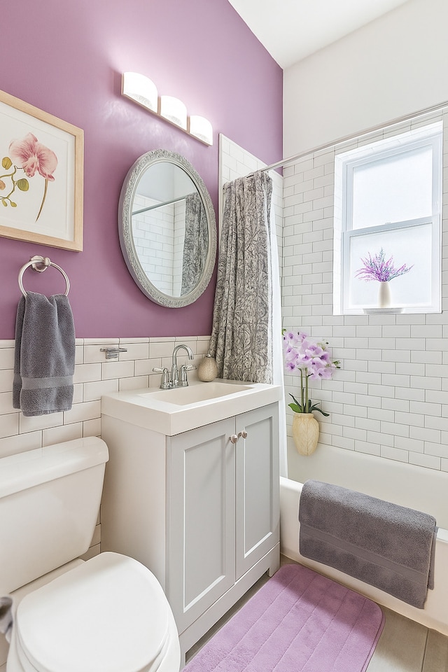 5127 S Artesian Ave, Chicago, IL 60632 - bathroom featuring vanity, shower / tub combo with curtain, a wainscoted wall, and tile walls