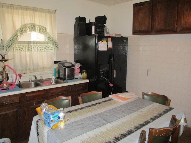 1525 Gunderson Ave, Berwyn, IL 60402 - kitchen with black fridge, tile walls, a sink, dark brown cabinets, and light countertops