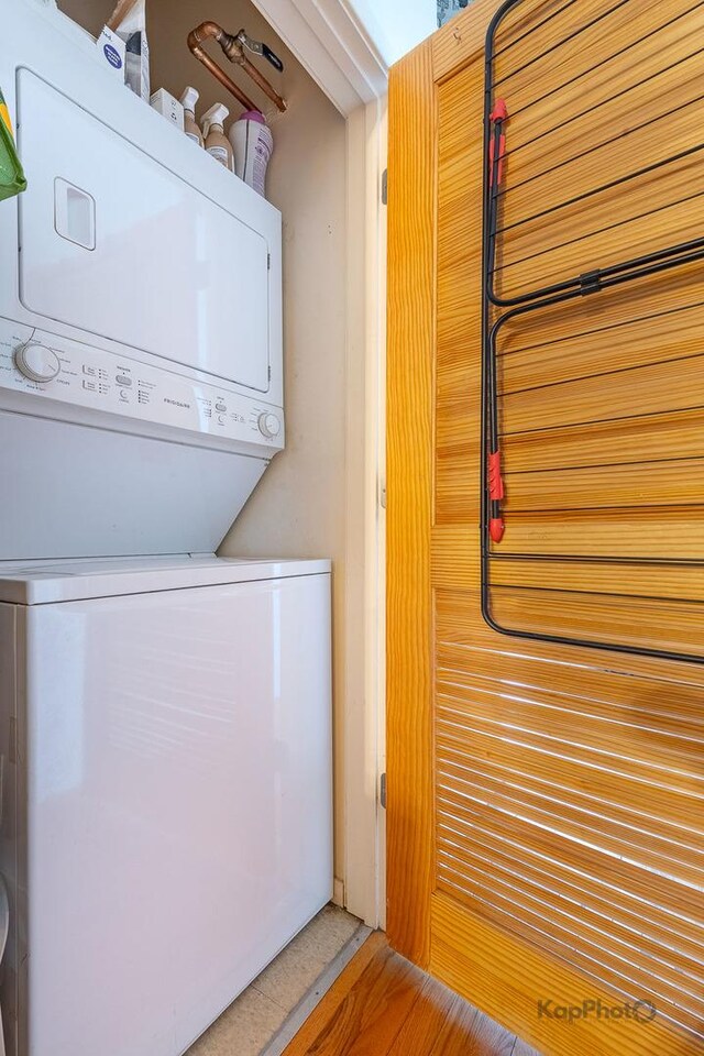 laundry area featuring estacked washer and dryer