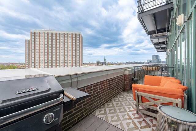 balcony with grilling area and a view of city