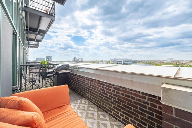 balcony featuring a view of city