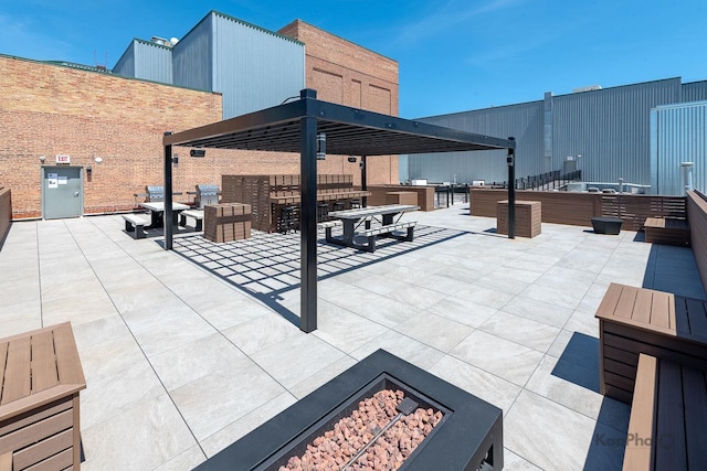 view of patio / terrace featuring a fire pit and a gazebo