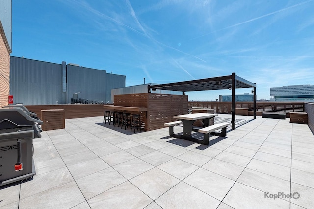 view of patio with grilling area and fence