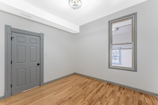 6602 S Marquette Ave, Chicago, IL 60637 - unfurnished room featuring light wood-style flooring and baseboards