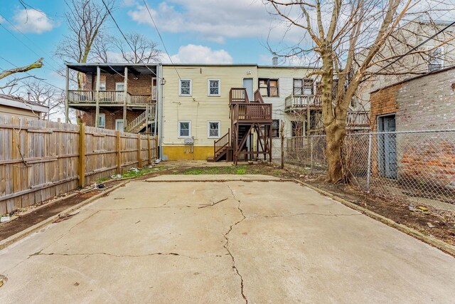 6602 S Marquette Ave, Chicago, IL 60637 - rear view of property with stairway and fence