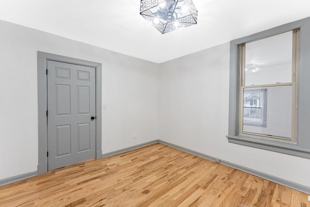 6602 S Marquette Ave, Chicago, IL 60637 - empty room featuring light wood-style flooring and baseboards